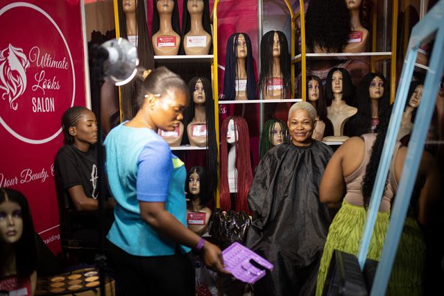 Styling a client at the branded exhibition booth